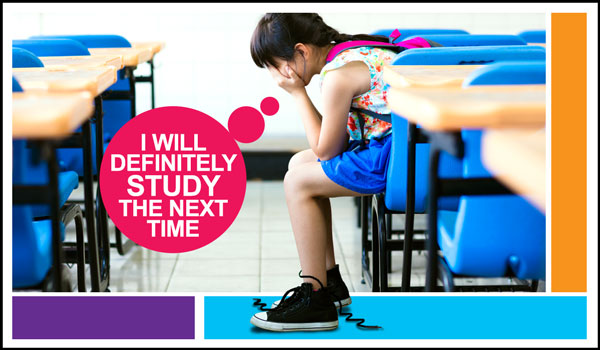 Girl sitting in a classroom regretting