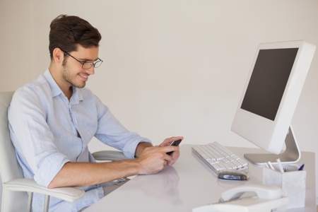 Man Using Mobile while Working