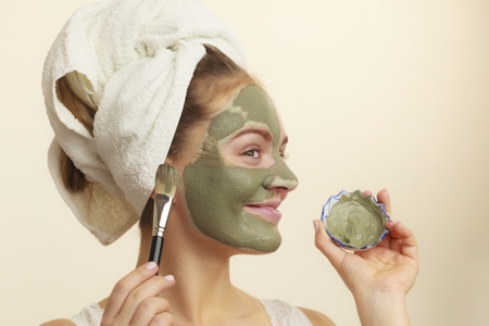 Woman applying face pack
