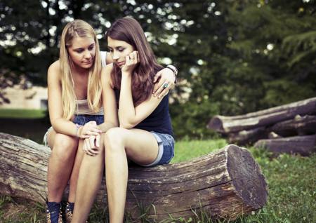 Girl consoling her friend