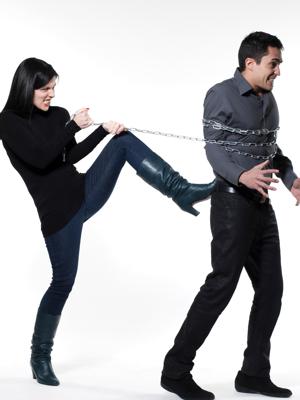 Women tying man in chain