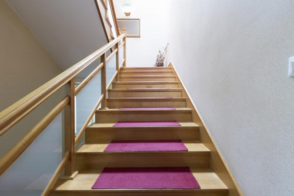 Purple carpet tiles for wooden staircase