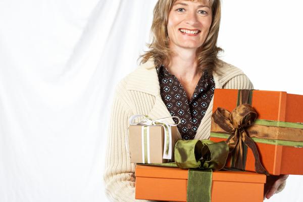 Woman holding wrapped gifts