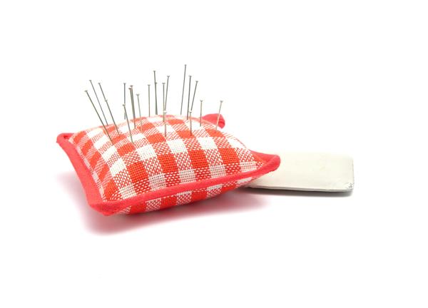 Pin cushion with pins and chalk