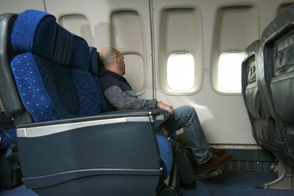 Passenger sleeping in airplane