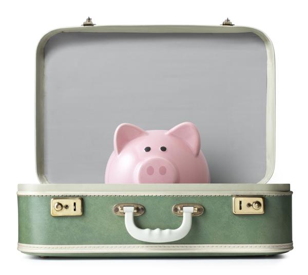 Piggy bank on suitcase