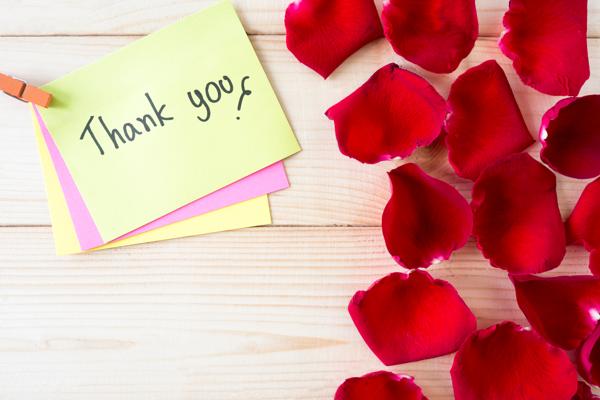 Thank you note with rose petals