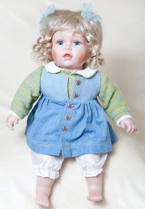 Blue eyed girl porcelain doll