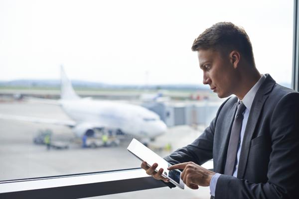 Man using tablet at airport
