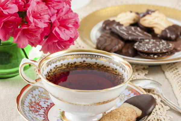 antique teacup with cookies