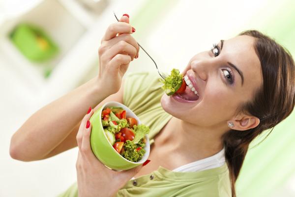 Girl eating healthy salad