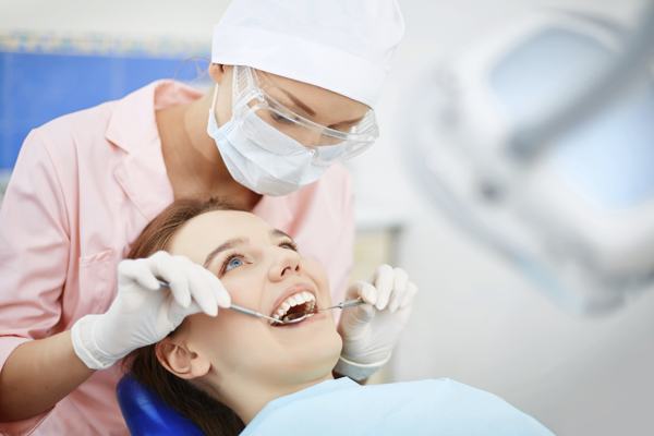 Dentist examining teeth