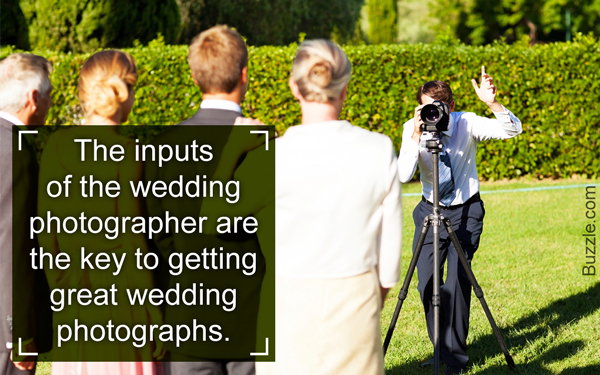 Wedding photographer taking a group photograph