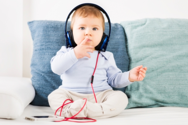 Small baby listening to music