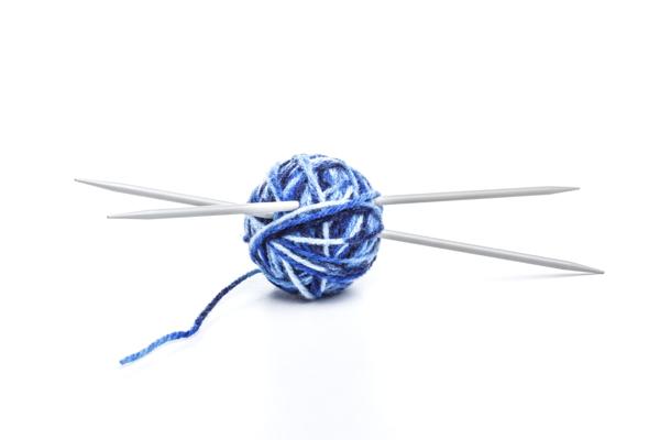 Blue ball of yarn with needles