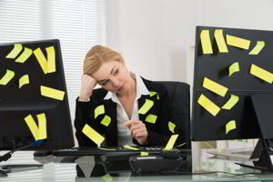 Businesswoman With Adhesive Notes In Office