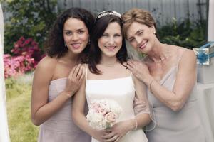 Bride , mother , and bridesmaid